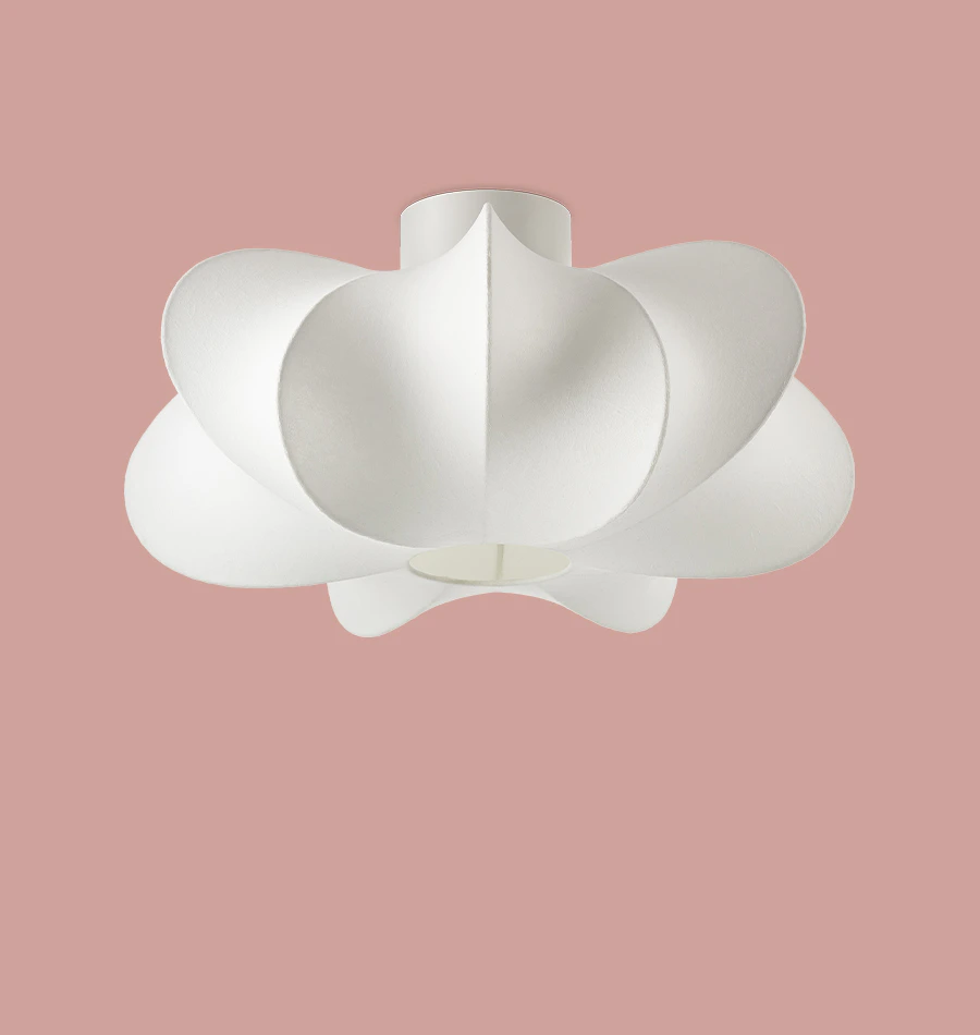 en vit plafond i organisk form är frilagd mot en rosa bakgrund