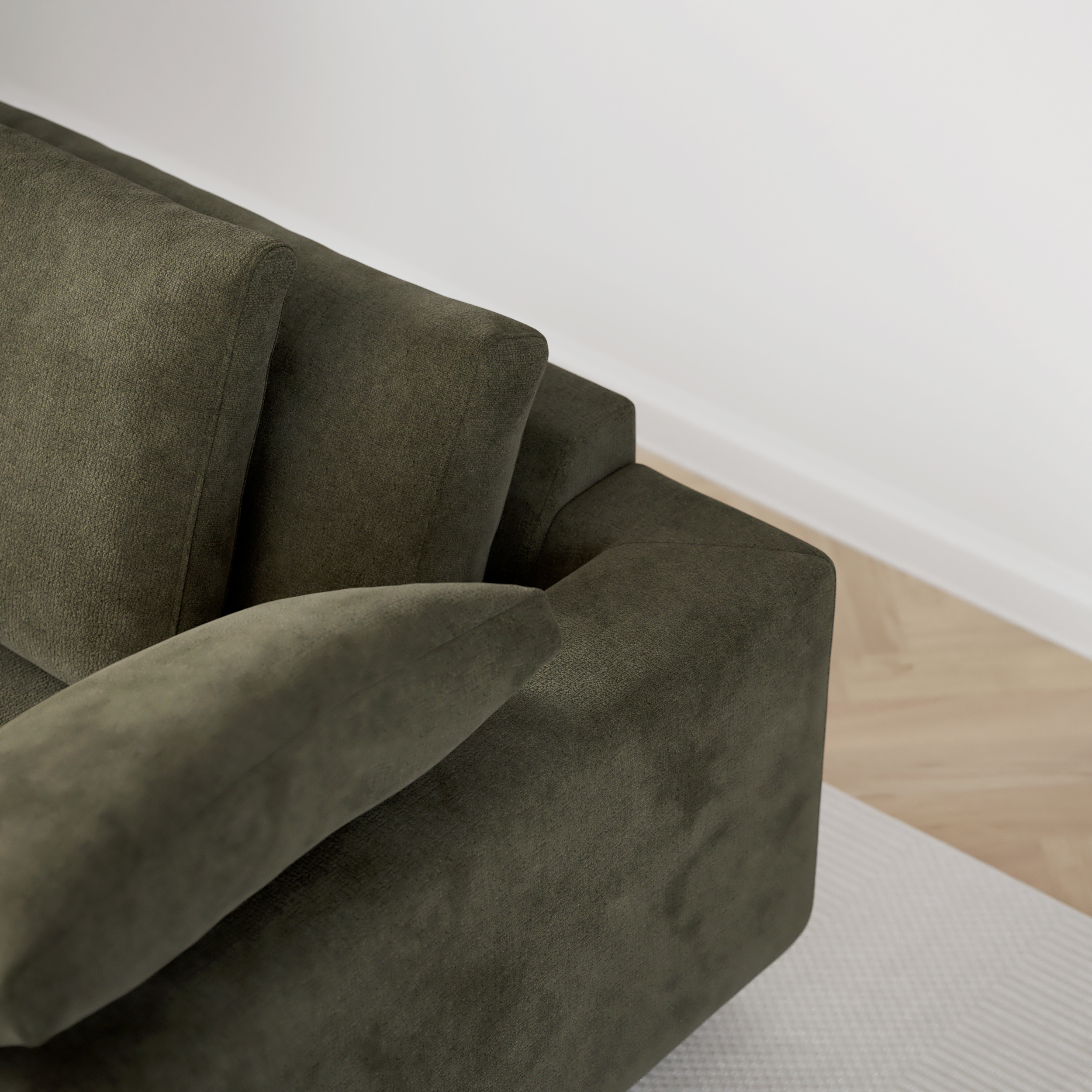 Närbild på soffans rygg med dess två ryggkuddar