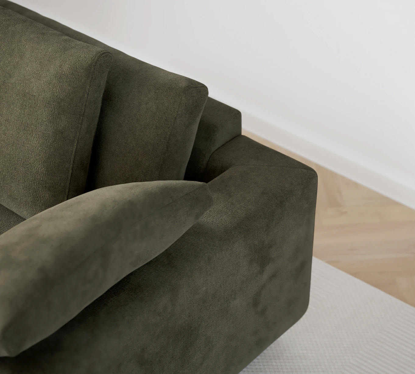 Närbild på soffans rygg med dess två ryggkuddar