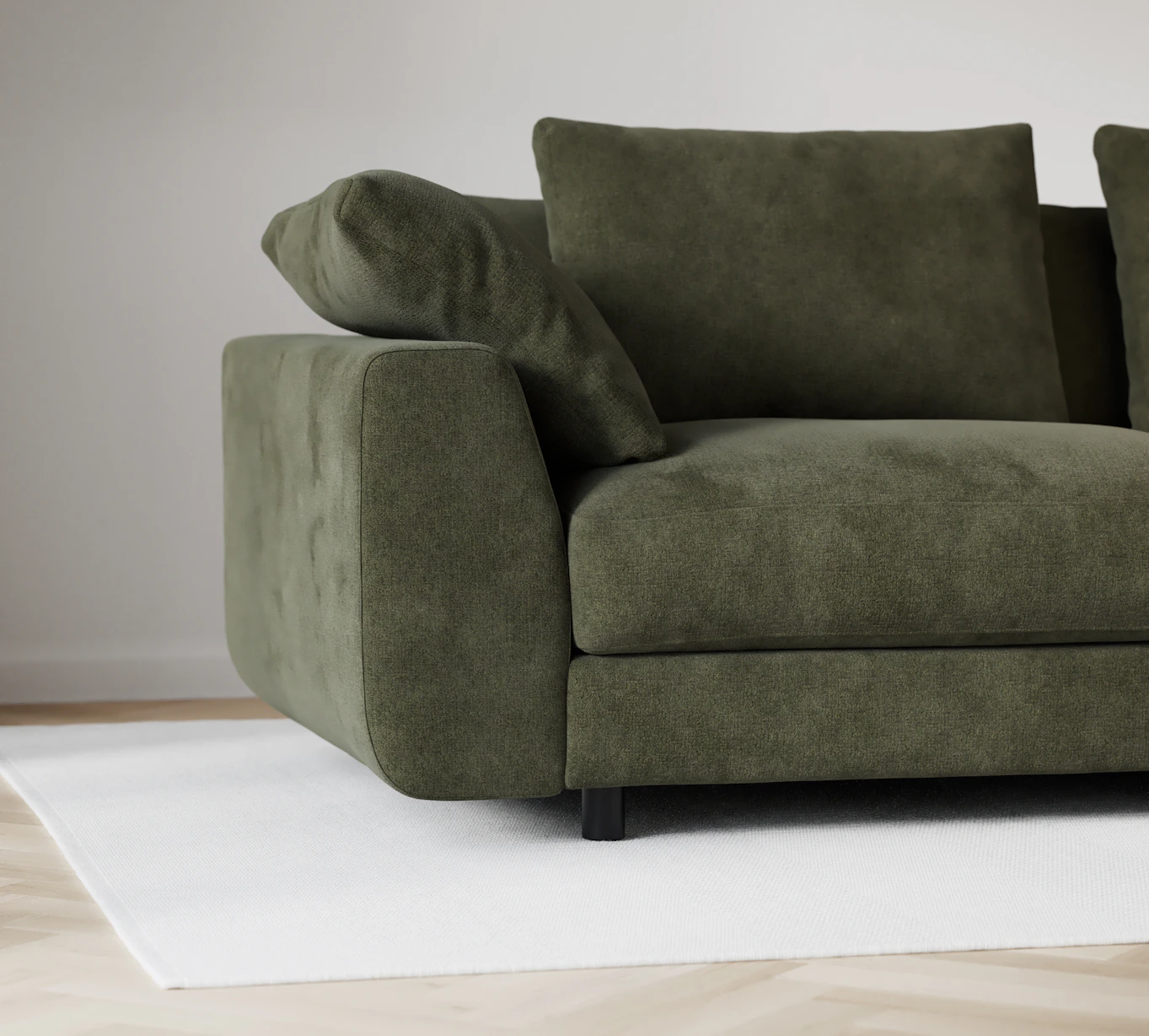 Närbild på soffans armstöd med rundade, mjuka hörn