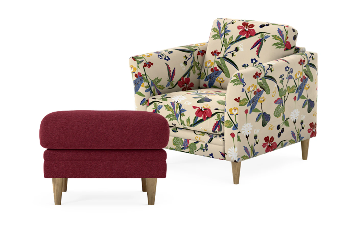 Bild som visar Eden fåtölj i blommigt tyg och en röd fotpall
