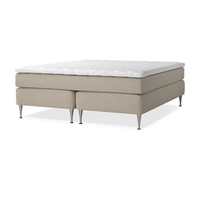  en beige kontinentalsäng
