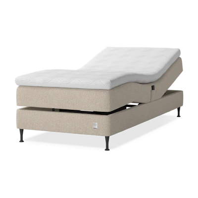 en beige ställbar enkelsäng